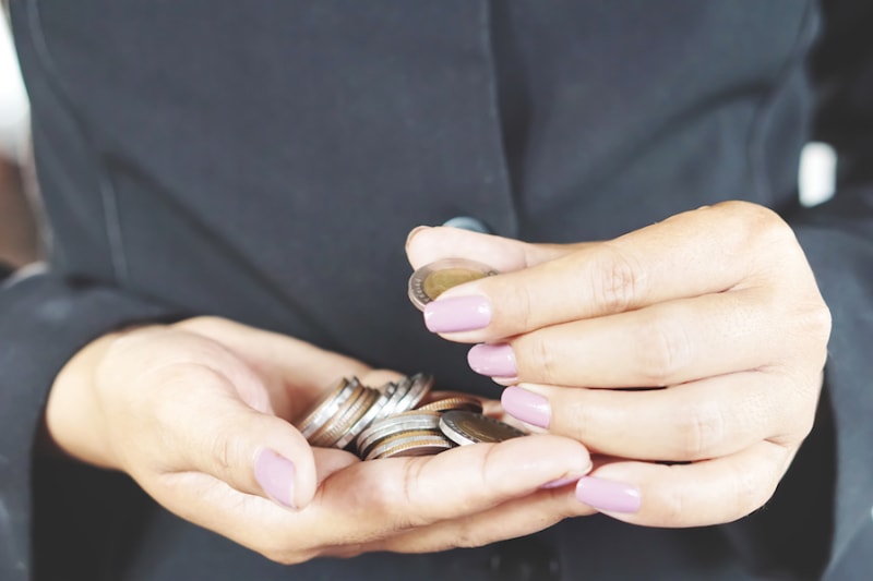business woman counting money in hands, banking or financial concept